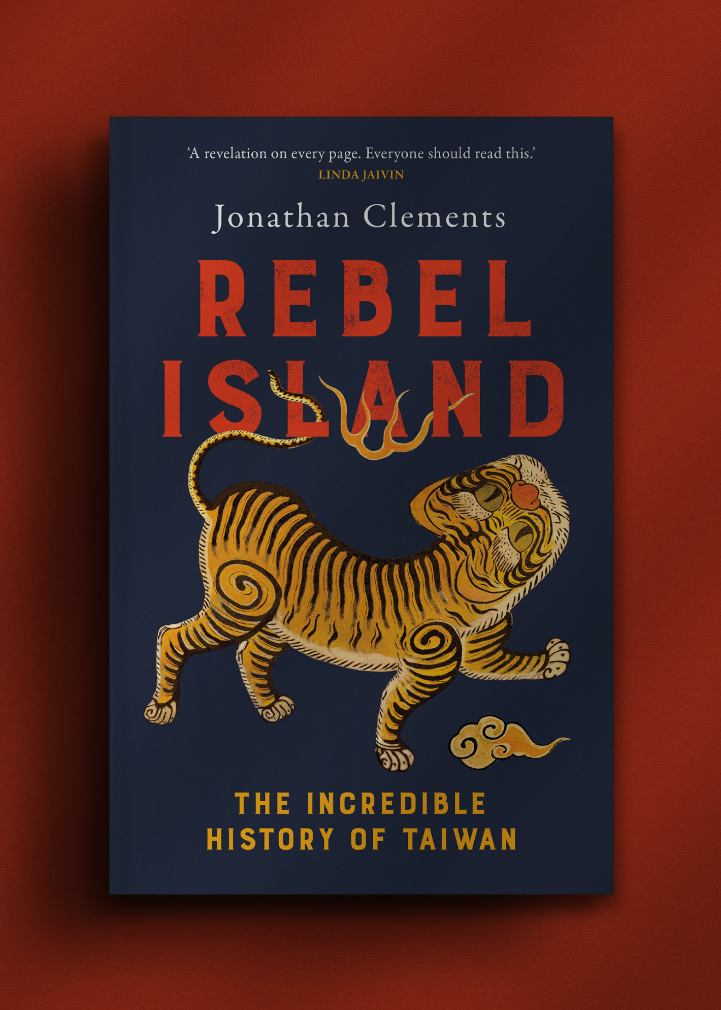 Book cover of "Rebel Island" by Jonathan Clements. Features an illustrated tiger on a dark background with bold orange and yellow text.