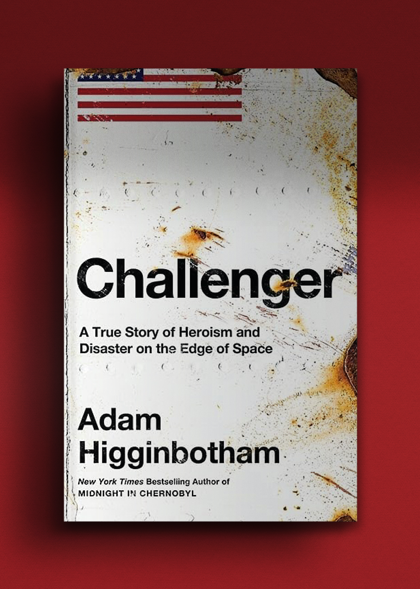 Cover of "Challenger" by Adam Higginbotham, depicts a weathered American flag and textured metal surface.