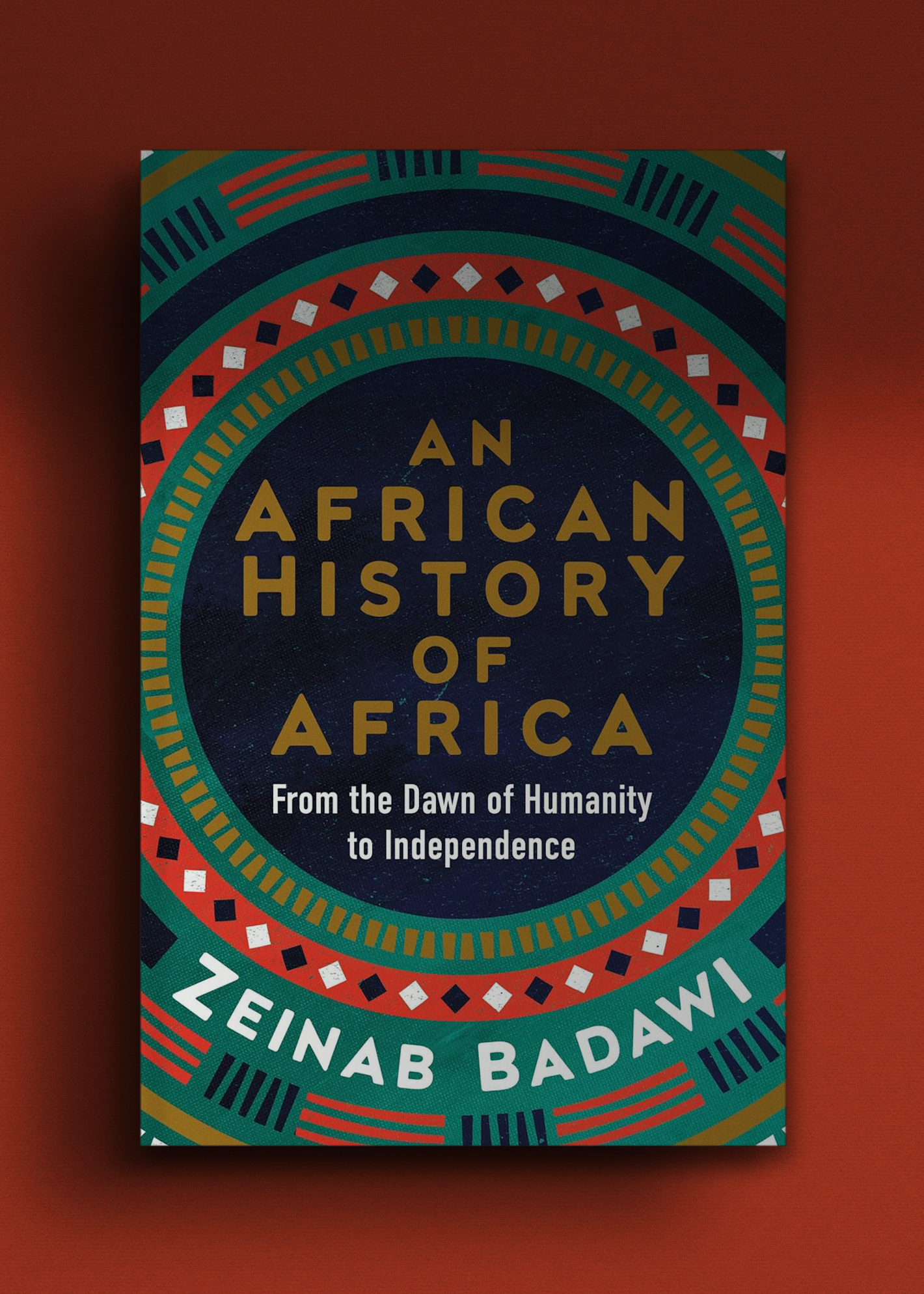A brightly colored book cover with geometric patterns in red, blue, and green. The title, "An African History of Africa" by Zeinab Badawi is prominently displayed.